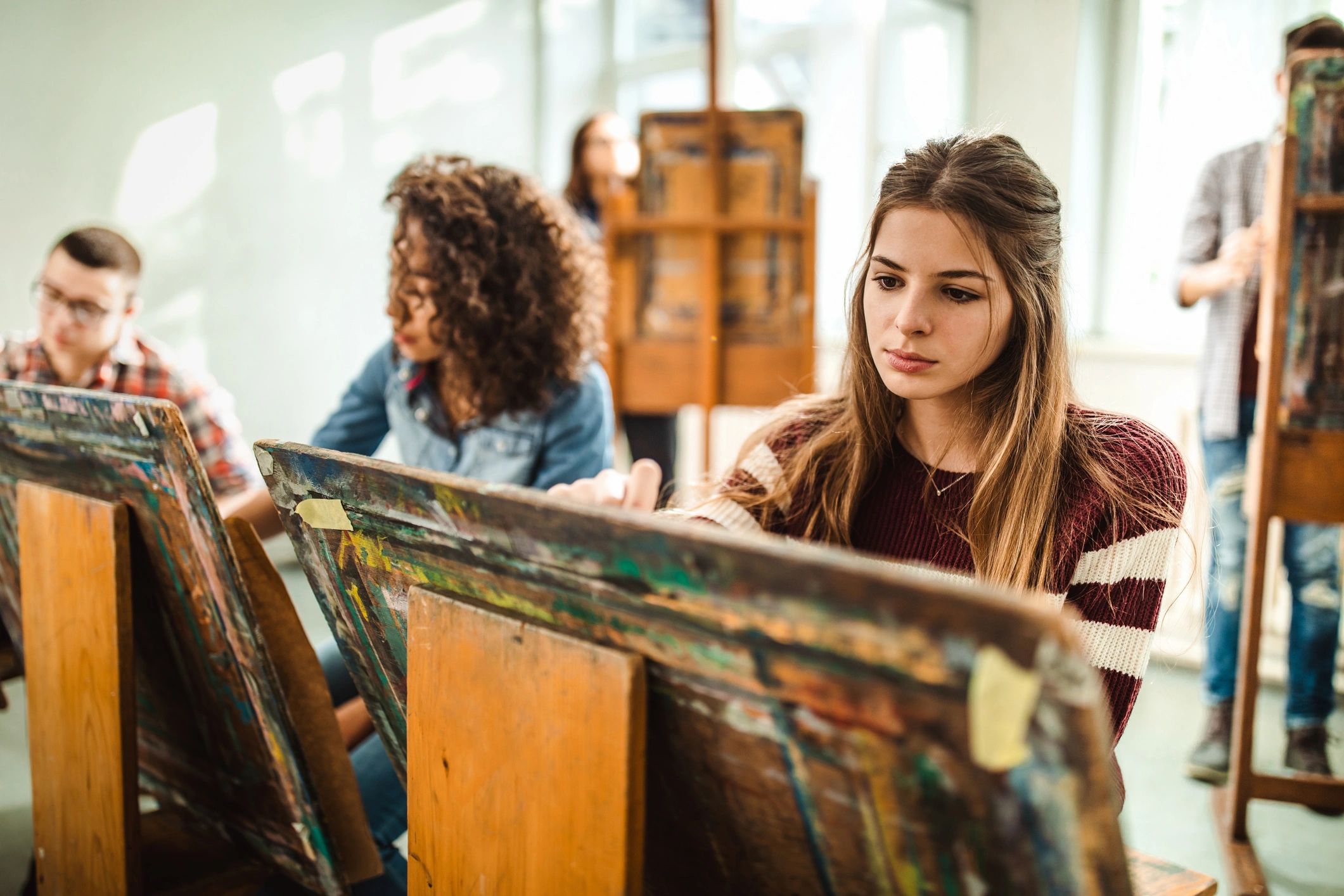 Students creating art in a studio setting
