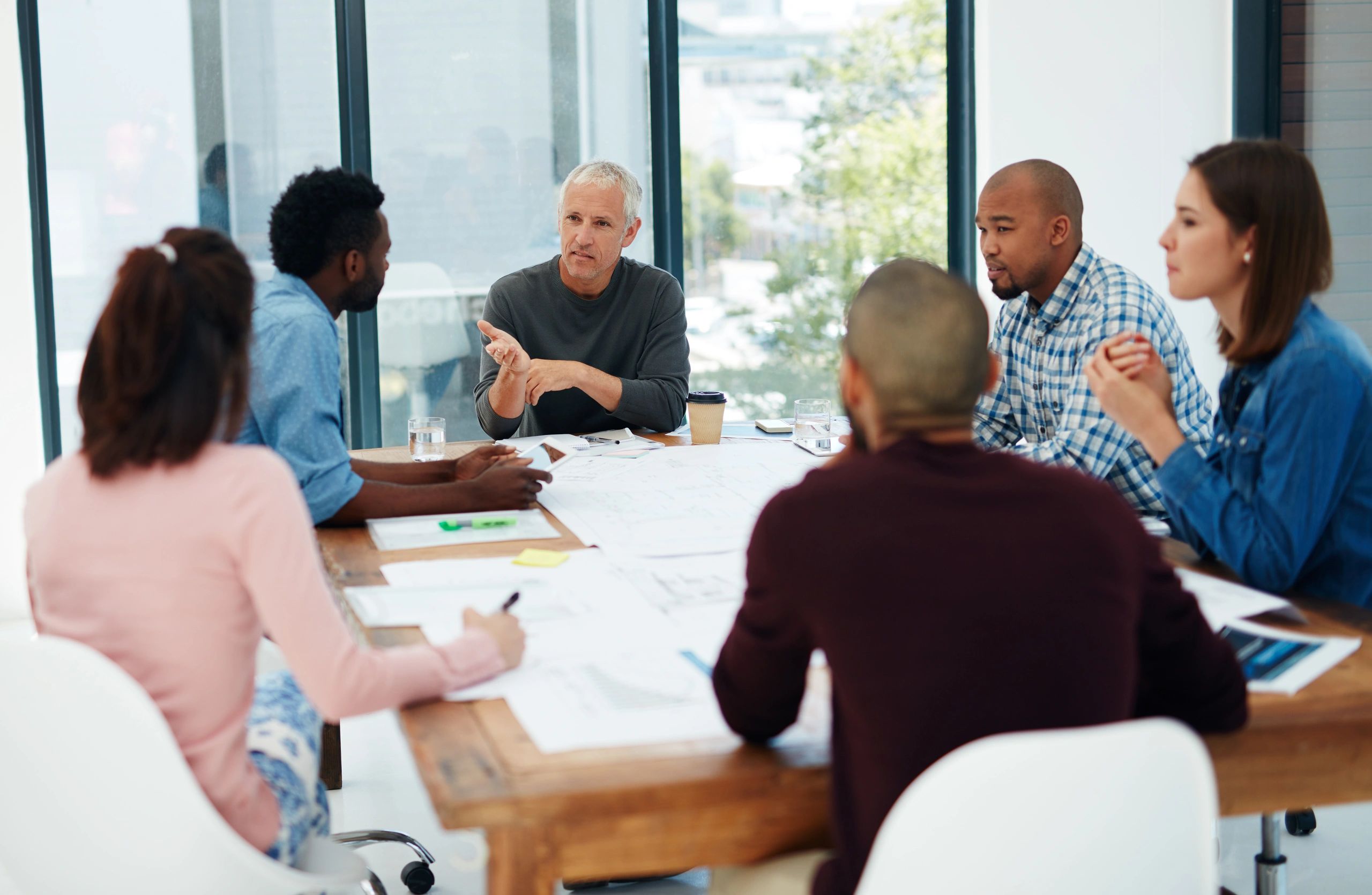 Community members meeting and organizing around a table