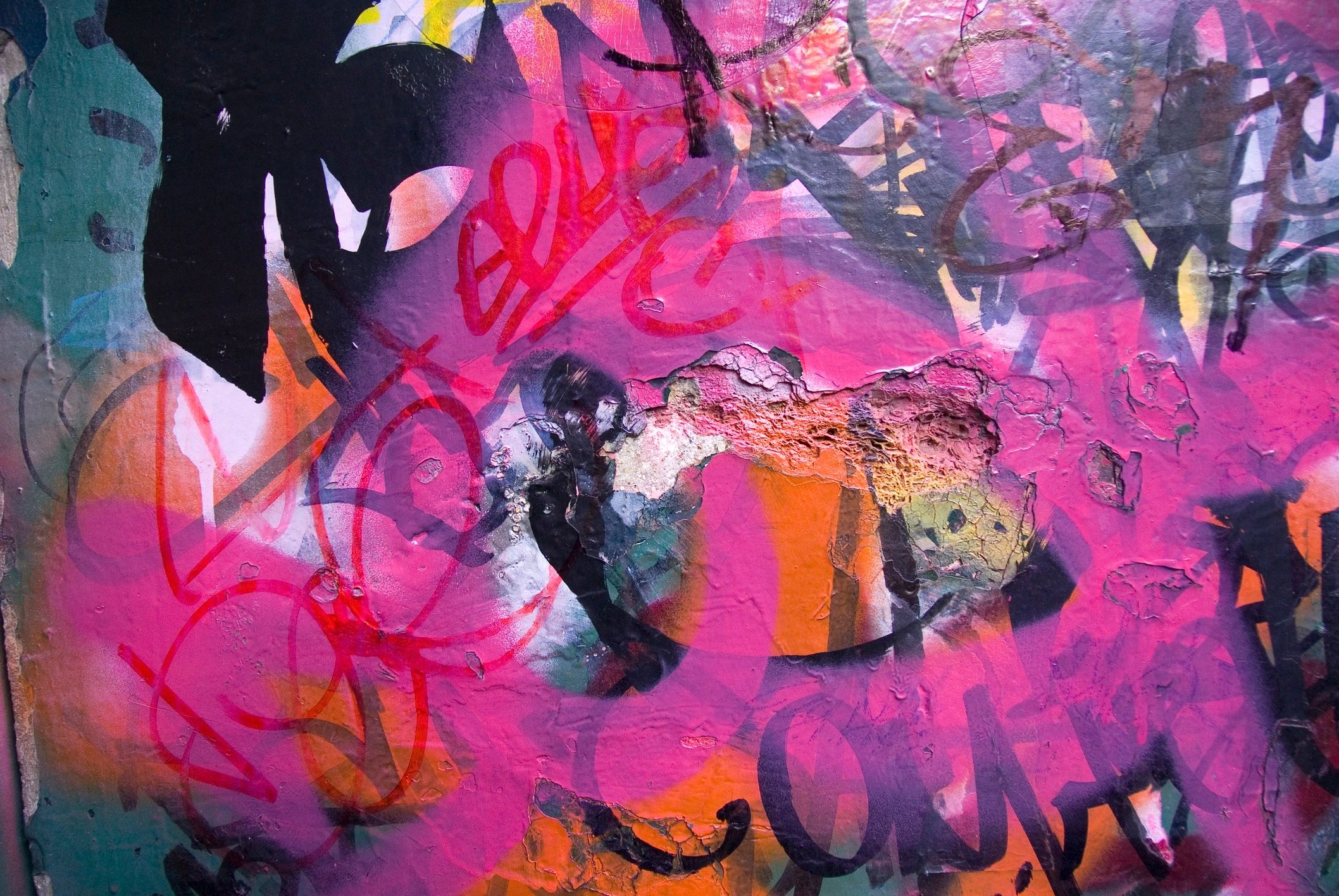 Graffiti and street art detail on a wall